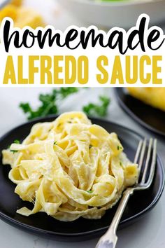 homemade alfredo sauce on a black plate with a fork next to it and the title overlay reads homemade alfredo sauce