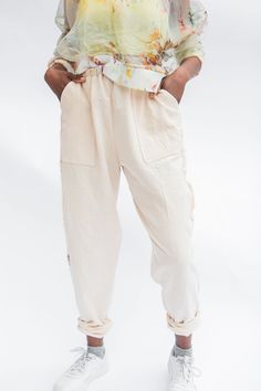 The Pocket Pant in Natural offers an inclusive fit with a relaxed silhouette and elasticized waist for optimal comfort. Crafted from 100% hand woven cotton, these pants feature lined patch pockets, a hand dyed pseudo tuxedo stripe and a cuff for an extra touch of style. Key Features include: 100% Handwoven organic cotton Self-lined cuffs and pockets Soft, elastic waist Hand dyed cotton scrap strip in side seam Ameera is wearing the XS Pocket Pant with S/M Silk Sweatshirt in Spring Size Waist, Un Spring Loungewear Harem Pants With Side Pockets, Summer Relaxed Fit Sweatpants With Elastic Cuffs, Spring Harem Pants With Side Pockets For Loungewear, Spring Side Pockets Harem Pants For Loungewear, Relaxed Fit Sweatpants With Tapered Leg And Patch Pockets, Summer Tapered Leg Pants With Elastic Cuffs, Relaxed Fit Cotton Harem Pants With Elastic Cuffs, Relaxed Fit Sweatpants With Hip Pockets For Spring, Cotton Relaxed Fit Harem Pants With Elastic Cuffs