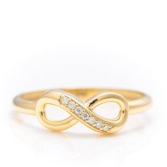 14k Solid Gold Iconic Infinity Ring, Real Gold Premium Infinity Band, Unique Design Ring For Her, Handmade Fine Jewelry By Selanica. 💙 The ring material is 14k solid gold, should not be confused with gold plating or filling. It will never tarnish or fade over time. We're offering the finest quality in solid gold jewelry. 💎 Gemstones are premium grade D Color (colorless) VS/SI clarity moissanites.  💙 Our jewelry is handcrafted with love and great care at San Francisco Bay! All of our items are 14k stamped for authenticity. You will receive them exactly as pictured.  💙 Quick shipping - Your order will be handcrafted and shipped in a few days. 🎁 They are delivered in a nice jewelry box, ready to be presented as a precious gift. 💎 Moissanite is the best alternative for natural diamonds a Symbolic Diamond Accented Rings For Anniversary, Formal Gold Diamond Ring Si Clarity, 14k Gold Infinity Jewelry With Diamond Accents, Gold Infinity Ring For Formal Occasions, Adjustable Infinity Promise Ring, Yellow Gold Infinity Rings For Formal Occasions, Formal Yellow Gold Infinity Rings, 14k Gold Stackable Infinity Rings, Stackable Infinity Rings In 14k Gold