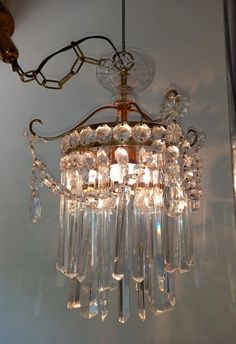 a chandelier hanging from the ceiling in a room