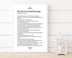 the art of a good marriage poem on a white wall next to a small lantern