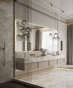 an elegant bathroom with marble walls and flooring, along with large mirrors on the wall