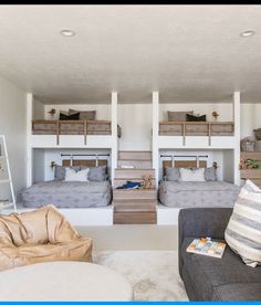 a living room with bunk beds and couches in the middle of it on instagram