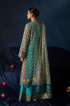 Blue Pakistani Wedding Dress in Kameez Trousers Style is an embellished attire that will give you a head-turning appearance on a magical day. Intricate details of zardosi, gota, and threads make this beautiful masterpiece an epitome of beauty and your foremost priority. Net Kameez The beautiful kameez in the premium net is emblazoned with intricate details of zardosi and threads. Classic gota and embroidery work give a perfect finishing look to the kameez, making it a perfect attire to wear on t Ammara Khan, Black Velvet Shirt, Pakistan Clothes, Silky Pants, Raw Silk Fabric, Pakistani Wedding Dress, Desi Clothes, Embroidery Suits Design, Embroidery Suits