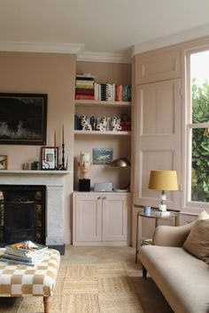 a living room filled with furniture and a fire place