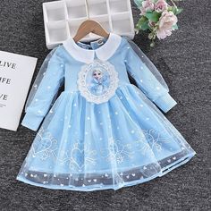 This high-quality long-sleeved Toddler Girls Elsa Dress is crafted from soft, breathable cotton and mesh, with a stylish ball gown silhouette and adorable cartoon design. Perfect for putting on a royal display at any time, this dress is designed for girls aged 2-8 years. Comfortably lightweight, the dress also features a full-length sleeve and a flattering O-neck. Let her experience the enchantment of Arendelle with this stunning Elsa dress--perfect for dress-up games with her pals! Transform yo Long Sleeve Tutu Dress For Dress-up In Spring, Long Sleeve Tutu Dress For Spring Dress-up, Long Sleeve Princess Dress For Dress-up, Cute Long Sleeve Dress For Dress-up, Cute Long Sleeve Dress-up Dresses, Cute Long Sleeve Cotton Dress, Winter Princess Dress With Long Sleeves, Long Sleeve Tulle Tutu Dress, White Long Sleeve Princess Dress