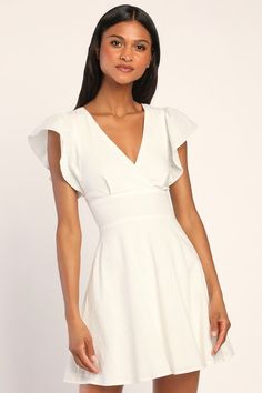 You'll be ready for any summer soiree with the Lulus Sweeten Me Up White Flutter Sleeve Mini Dress With Pockets! This flirty dress has a cotton-blend composition, that shapes a surplice neckline, flutter short sleeves, and two tying straps that come together at the back. The fitted, banded waist sits atop a breezy skater skirt that boasts side seam pockets and ends at a mini hem. Fabric: Fabric has no stretch. Front of bodice and skirt is lined. Shell: 100% Cotton. Lining: 100% Rayon. Hand Wash Engagement Party Dresses, Summer Soiree, Mini Sundress, Flirty Dresses, Surplice Neckline, Mini Skater Dress, Dress With Pockets, Mini Dress With Sleeves, Full Skirt