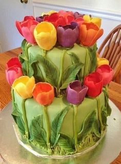 there is a cake decorated with flowers on the table