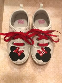 Custom hand painted shoes  Thanks for looking at my hand painted Minnie Mouse shoes. These are tennis shoes with hand painted Minnie mouse faces on the front and Polka dots on the back.  I can do different ribbons as well (pink, polka dots, red, etc.) These are perfect with a Minnie Mouse dress, shirt or birthday outfit!  I can also do Mickey Mouse!  They make a wonderful one-of-a-kind gift! I can do other character shoes as well, if you don't see what you are looking for, just ask. MOST SIZES AVAILABLE (infant, toddler, children, youth) Hand painted with non-toxic paint  Since these are made to order, please allow 2 to 3 weeks before shipping. Minnie Mouse Shoes, Mouse Dress, Girls Shoes Sneakers, Minnie Mouse Dress, Hand Painted Shoes, Sneakers Athletic, Custom Hand Painted, Painted Shoes, Girls Sneakers