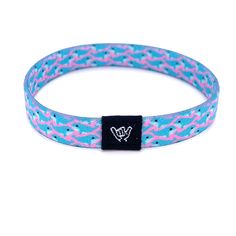 "Find yourself on a whale watching adventure with our pink and blue Free Willie band. Get ready to make waves with these beachy bracelets! Super comfy on your wrist and they keep their vibrant colors all summer long. Stack them up, mix and match with our knotband bracelets. Available in bracelet lengths: Extra Small 5.5\" Small 6.5\" Medium 7.5\" Anklet 9\" 3/8\" Width Reversible surf, music and beachy prints. Elastic blend material, can stretch to desired fit. Packaged in natural drawstring gif Casual Band Bracelets For Friendship, Adjustable Band Bracelet Casual Style, Flexible Blue Summer Bracelet, Adjustable Casual Band Bracelet, Blue Flexible Casual Bracelet, Casual Blue Flexible Bracelets, Casual Flexible Blue Bracelets, Adjustable Casual Wristband, Casual Adjustable Wristband