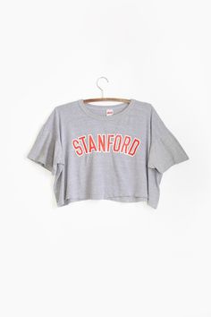 80s Stanford t-shirt | Vintage 1980s Stanford University college California cropped T-shirt by CALIVINTAGEUSA on Etsy Retro Cropped T-shirt With Letter Print For Spring, Cropped Crew Neck T-shirt With Graphic Print For College, Cropped Short Sleeve Letter Print T-shirt For College, Cotton Graphic Tee Cropped Shirt With Letter Print, Short Sleeve Cropped T-shirt With Letter Print For College, Cropped Letter Print T-shirt For College, Cropped Short Sleeve T-shirt With Letter Print For College, Cotton Cropped Shirt With Letter Print, Sporty Cropped T-shirt With Text Print