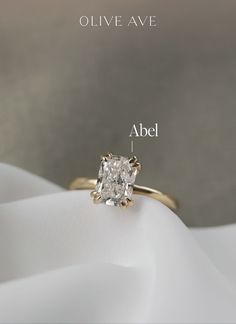 an engagement ring with the names above it