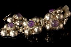 "This is a very beautiful, vintage and very unique MEXICAN AMETHYST CABOCHON SILVER bracelet (weight 33.3g). The bracelet has a marvelous and chic style with nice flower shape, amethyst cabochons and silver(bottom has MEXICO SILVER). The bracelet has a very extravagant and elegant feel to it. It measures 7\" long and 3/4\" wide. The bracelet is in good condition, has small dent. 0.7 BR" Vintage Amethyst Cabochon Jewelry, Vintage Sterling Silver Bracelet With Gemstone, Vintage Silver Amethyst Bracelets, Vintage Amethyst Bracelet Jewelry, Nice Flower, Mexican Silver Jewelry, Hinged Bracelet, Vintage Navajo, Vintage Mexican