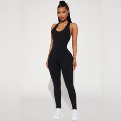 Sleeveless And Padded With Back Cut Out. Chic Sleeveless Bodysuit For Loungewear, Sleeveless Athleisure Bodysuit For Night Out, Black Sleeveless Workout Jumpsuit, Sleeveless Black Jumpsuit For Workout, Black Sleeveless Jumpsuit For Workout, Sleeveless Athleisure Bodysuit For Loungewear, Chic Black Workout Jumpsuits And Rompers, Sporty Black Sleeveless Jumpsuits And Rompers, Black Sleeveless Sporty Jumpsuits And Rompers