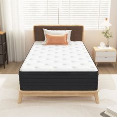 an image of a mattress in the middle of a room with white carpet and windows