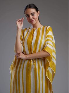 Editor's Note Featuring a yellow and white stripe kaftan. Color: Yellow; White Fabric: Chanderi Silk Care: Dry Clean Only About the Designer KoAi means "Love Child" Non-fussy clothes for everyday wear. These pieces can be worn at any time of the day.i.e for work, brunch, evening wear, by the pool. Basically everywhere. Summer Striped Tunic Kaftan, Yellow Kaftan, Kaftan For Women, Bandhani Dress, Stripe Outfits, Yellow Print, Brunch Outfit, Indian Designer Wear, Designer Wear