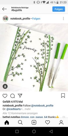 a notepad with green flowers on it and two pens next to the page that says notebook profile