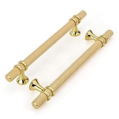 two golden handles and knobs on a white background