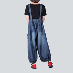 Introducing our 2023 Autumn Collection of 90s-inspired mid wash denim dungarees ââ‚?a timeless classic that's set to revolutionize your wardrobe!Why They're Your Next Wardrobe EssentialDesigned to bring back the nostalgic vibes of the '90s. these denim dungarees are the perfect balance between contemporary fashion and vintage style. With their unique baggy fit and suspender closures. they exude an effortlessly cool attitude that's sure to make a statement.Distinctive Features: 90s-Inspired Style Retro Dark Wash Cotton Denim Jumpsuit, Denim Blue Washed Overall Jeans, Baggy Denim Blue Jeans Overall, Denim Overalls With Relaxed Fit, Dark Wash Baggy Overalls, Denim Blue Retro Overalls, Retro Denim Blue Overalls, Dark Wash Wide Leg Relaxed Fit Overalls, Retro Denim Blue Jumpsuit