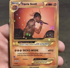 a person holding up a card in their hand with the name travis scott on it