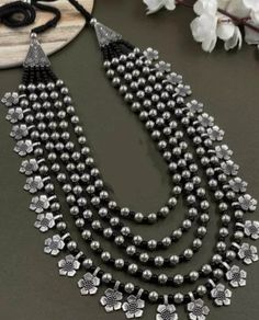 Multilayer Long Flower Bead Necklace Silver black Handmade Indian jewelry, Oxidized Necklace, Jewelry Set Gift for her Wedding necklace This bead necklace amplifies the elegance and beauty of Indian women. Choose this excellent piece of handmade Indian jewelry to make heads turn. Its adjustable length makes it easy to wear and can be paired with sarees or ethnic dresses. Made with premium quality material, you can rest assured of its quality. You can also select this piece as Navratri jewelry an Luxury Necklace For Ceremonial Navratri, Flower Bead Necklace, Jewelry Oxidized, Ethnic Dresses, Long Flowers, Oxidized Necklace, Oxidised Jewellery, Multi Strand Necklace, Indian Jewellery