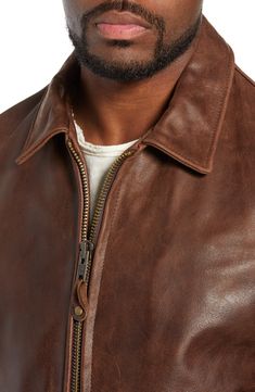 A high polish elevates the look of a full-grain leather jacket constructed with a soft cotton lining and shoulder-broadening sunray seaming on the back. Front zip closure Spread collar Angled welt pockets; interior pocket Adjustable side tabs with buckle closures Lined Buffalo leather Professional leather clean Made in the USA Classic Leather Jacket With Contrast Stitching, Rugged Leather Outerwear For Spring, Classic Leather Outerwear With Contrast Stitching, Leather Jacket With Contrast Stitching For Spring, Classic Collared Leather Jacket With Zipper, Classic Collared Leather Jacket With Zipper Closure, Spring Leather Jacket With Contrast Stitching, Rugged Fitted Leather Jacket With Double-needle Stitching, Fall Leather Jacket With Contrast Stitching