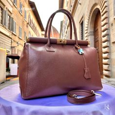 This bag has been made of the best genuine leather by local master crafters of Florence in Italy, designed for women who only accept premium Italian quality and luxury leather bags and modern Italian fashion. . Size: Height: 28 cm/11.02 inches. Width: 33 cm/12.99 inches. Depth: 15 cm/ 5.91 inches. Color: Dark Brown . The story of this bag:  In the heart of Italy, where artistry and craftsmanship have flourished for centuries, a group of skilled artisans pours their passion into creating exquisit Elegant Brown Textured Leather Bag, High-end Bags With Leather Lining For Daily Use, High-end Brown Soft Leather Shoulder Bag, High-end Bag For Everyday Use, High-end Leather Bags For Daily Use, Luxury Italian Brown Shoulder Bag, High-end Rectangular Bags With Smooth Grain, High-end Everyday Bag With Smooth Grain, High-end Leather Shoulder Bag With Smooth Grain