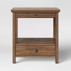 the side table is made from wood and has an open drawer on one side with two drawers