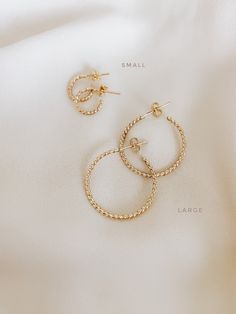 These sparkly twist Hoops are totally gorgeous and unique for everyday use and never take off. So effortless and chic with a spectacular shiny style. If you like simple, classy, and Unique hoops, these earrings are perfect for you. They make elegant, versatile hoops. Material: gold filled rose gold filled sterling silver Diameter: *small: 10mm *large: 25mm *ADDITIONAL INFORMATION* These earrings have been created by hand so no two pieces are identical. Each pair will vary in the exact size, shap