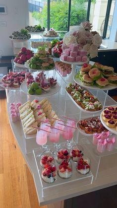 a table filled with lots of desserts and pastries