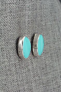 These Sonoran Gem turquoise and sterling silver earrings were made by Navajo silversmith Marco Begaye. The backs are stamped sterling.Length: 5/8"Width: 1/2"Free shipping on all orders! We ship with USPS and always include tracking. All orders ship within a day of payment.Returns are accepted up to 30 days after you receive your order. Just send us a message. Our shop offers cash back or store credit. The item must be returned in new condition. Bear Carving, Pearl Chain, Native American Jewelry, Turquoise Sterling Silver, Free Jewelry, White Vintage, Sterling Silver Earrings, Silver Earrings, Jewelry Gifts