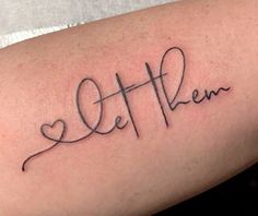 a woman's arm with the word love written in cursive writing