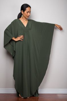 "Fast shipping to the US.  We've been designing and making these dresses for over 15 years.  High quality at an affordable price.  Kaftan Maxi dress in olive green, Women's caftan frock dress with plunging neckline, Loose fit christmas holiday dress  Funky Elegant Collection --> Produced by NUICHAN & Co   PRODUCT SIZE : One Size Fits Most * Chest : free up to 32 - 58\" * Waist : free up to 58\" * Hips : free up to 56\"  * Length : 58\" from shoulder to hem (measured when laying flat) > 59\" when Kaftan Frock, Kaftan Style Dresses, Maxi Frocks, Dress With Plunging Neckline, Kaftan Pattern, Fitted Maternity Dress, Ladies Caftan, Kaftan Designs, Funky Dresses