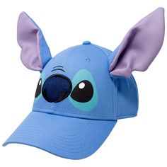 a blue hat with an elephant's ears on it and eyes painted on the front