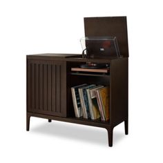 an entertainment center with a record player, cd player and stereo in the top shelf