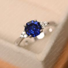 This ring features a 7*7 mm octagon cut lab sapphire. Customization is available. It is made by hand, and it will take about 7 days to finish the ring after your payment is completed. Main stone: 7*7 mm octagon cut lab sapphire Main stone weight: 1.91 ct Metal type: sterling silver /14k gold Accent stone: cz Customization is available, just fee free to contact me, it is free to engrave inside the ring, it is free, you can leave a ntoe with your order, but it will be great no more than 15 letter. Blue Sapphire Promise Ring, Heart Cut Ring, Moonstone Engagement Ring Rose Gold, September Birthstone Ring, Original Engagement Rings, September Birthstone Rings, Blue Gemstone Rings, White Sapphire Ring, Blue Sapphire Ring