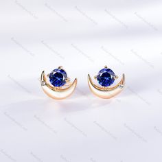 Delicate Round Cut Blue Sapphire Earrings Rose Gold Cluster crescent Moon Stud Earrings Women Vintage Promise Anniversary Gift for Her Jewelry Radiant Jewelry takes pride in offering handcrafted engagement rings that undergo rigorous quadruple-checks to ensure the highest quality. PRODUCT INFORMATION >Metal: SOLID 10K / 14K / 18K GOLD /S925 (can be made in white/rose/yellow gold) >Main Stone *Center Stone: Lab Sapphire *Size & Shape: 4.5mm Round Cut >Side Stones: *Center Stone: Cubic Zircon / Di Blue Celestial Round Earrings, Blue Round Earrings With Moon Charm, Blue Crescent Earrings As A Gift, Blue Crescent Moon Charm Earrings, Elegant Blue Earrings With Moon Charm, Celestial Blue Earrings For Party, Blue Moon Shaped Celestial Earrings, Celestial Blue Moon-shaped Earrings, Blue Celestial Moon Earrings