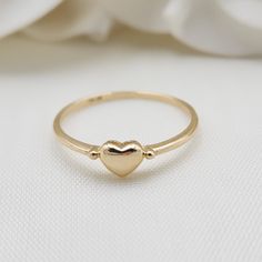 Beautiful stackable solid 14k gold mini polished yellow gold heart ring. Perfect to wear everyday, everywhere. Adorable, modern and everlasting. 14k Gold will not tarnish or rust. Perfect gift ! Materials: 14k Solid Yellow Gold Sizes: 5 to 10 Us Weight: 1.1 grams (approx) 14k stamped Brand new Fast shipping Elegant gift box included  Briza Collections is a small family owned business that works hard on providing the best selection of Fine Solid 14k Gold Jewelry for the best prices.  Our main goa Classic Stackable Yellow Gold Heart Ring, Classic Heart-shaped Stackable Promise Rings, Classic Gold Stackable Heart Ring, Simple 14k Gold-filled Rings For Anniversary, Simple 14k Gold Filled Rings For Anniversary, Dainty Gold Heart Ring For Everyday, Simple 14k Gold-filled Anniversary Rings, 14k Gold Heart Ring With Polished Finish For Wedding, Everyday Stackable Rings For Valentine's Day