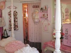 a bedroom with pink and white decor on the walls