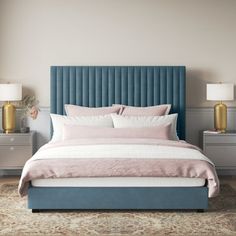 a bedroom with a blue headboard and two lamps on either side of the bed