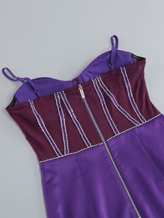 Unleash your inhibitions in our dazzling CORSET Dress. This strapless mini features a semi-sheer paneled corset with a rhinestone trim along the boning. It's complete with a hidden zipper and hook-and-eye closure at the side. Shown here in Royal Purple. Gentle Dry Clean OnlyColour may vary due to lighting on images. The product images (without model) are closest to the true colour of the product.Item runs true to size chart and is cut to suit our size chart. Please refer to our size chart for the best fit. Do not size up or down.