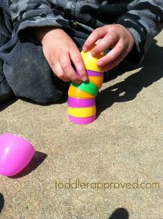 a child playing with toys on the ground