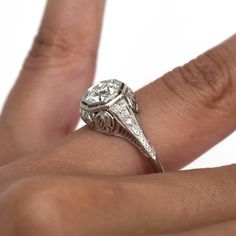 *VIEW A VIDEO OF THIS RING* https://youtu.be/4jrZPS28PDk This ring can be sized up or down 4 sizes for an additional $40. If you wish to have a ring sized please purchase the item and note the size in the message section. Item Details: Ring Size: 6.25 Metal Type: Platinum [Tested and Hallmarked] Weight: 3.5 grams Center Diamond Details GIA Center Diamond - Report # 2205507441 Shape: Old European Brilliant Carat Weight: 1.03 ct Color: J Clarity: SI1 Side Stone Details: Shape: Old European Brillia Gia Certified Art Deco Platinum Rings, Gia Certified Platinum Art Deco Ring, Gia Certified Art Deco White Gold Rings, Art Deco Platinum Halo Ring With Round Cut, Gia Certified Art Deco Rings, Heirloom Asscher Cut Gia Certified Diamond Ring, Gia Certified Diamond White Art Deco Rings, Gia Certified Art Deco Diamond White Rings, Gia Certified 14k White Gold Art Deco Ring