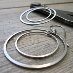 I have been having fun with stainless steel earrings lately and here is another pair. These are larger than the other pair listed (shown in the last few photos). These are 2" in total length and have a titanium ear wire. These are completely hypoallergenic earrings. The circle shaped connectors are perfect for a minimalist look. These will not tarnish or change over time. The largest circle link is 35mm in size, the small one is 25mm. These are smooth and exactly the same front and back. The jump rings are also stainless steel.  You have a choice on how these hang. Look at the 6th photo to see your choice.  To find all the stainless steel options in my shop start here, https://www.etsy.com/shop/CraftLikeAnArtist?search_query=stainless+steel Lake Forest, Steel Earrings, Hypoallergenic Earrings, Circle Shape, Gift For Friend, Stainless Steel Earrings, Circle Earrings, Having Fun, Ear Wire