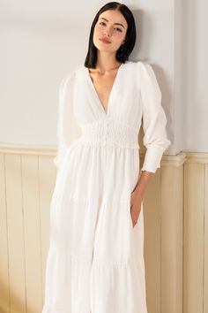 FINAL SALE! NO RETURNS. NO EXCHANGES. Georgia Maxi Dress will make a lasting impression at your next spring event! With an elastic waist, long sleeves, and tiered peasant skirt. LENGTH: 52" from top of shoulder FABRICATION: 100% White Linen STYLE#;DR-21450 White Linen - WHITE-S24 *Dry Clean or wash on cold and hang flat to dry *Model is wearing size XS Summer Work Dresses, Quincenera Dresses, Asymetrical Dress, Dancesport Dresses, Quinceñera Dresses, Georgia Dress, Dresses Work, Peasant Skirt, Yumi Kim