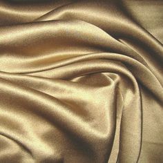 the fabric is shiny and gold in color