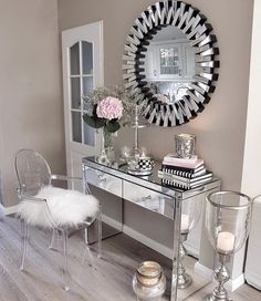 a desk with a mirror and some chairs