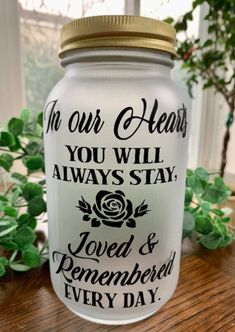 a glass jar with the words in our hearts you will always stay loved and remember every day