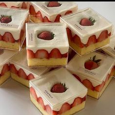 there are many pieces of cake with strawberries on them