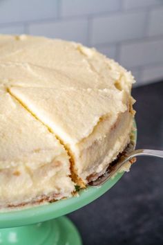 a close up of a cake on a plate with a fork